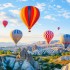 Colorful,Hot,Air,Balloons,Flying,Over,Rock,Landscape,At,Cappadocia